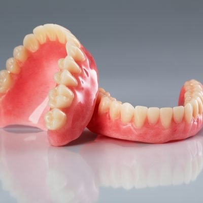 Regain your smile and chewing comfort with custom dentures at The Family Dental Clinics. Natural appearance, perfect fit.